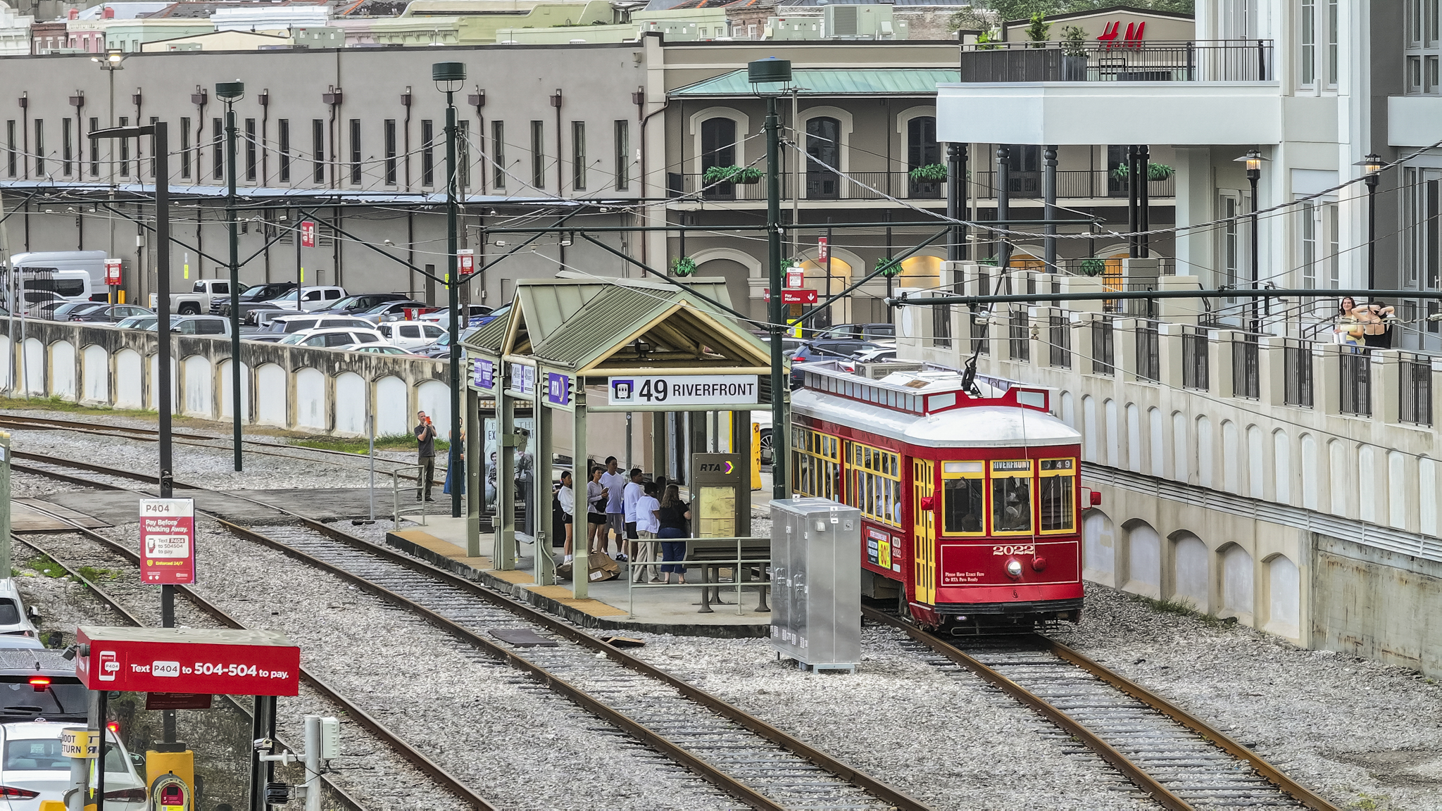 Red Riverfront streetcar at a New Orleans station near the river